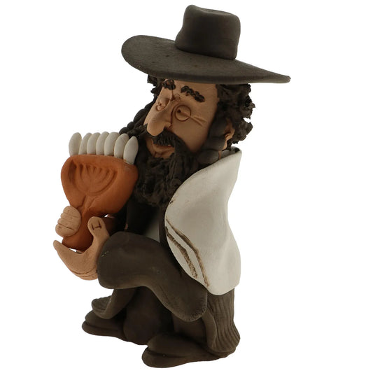 Handmade figurine made by retired artist Yuri Dogayev. The figurine portrays a Jewish man with a dark black beard and hat holding a Menorah.